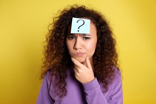 advanced system repair pro system optimizer woman with long curly hair wondering yellow background